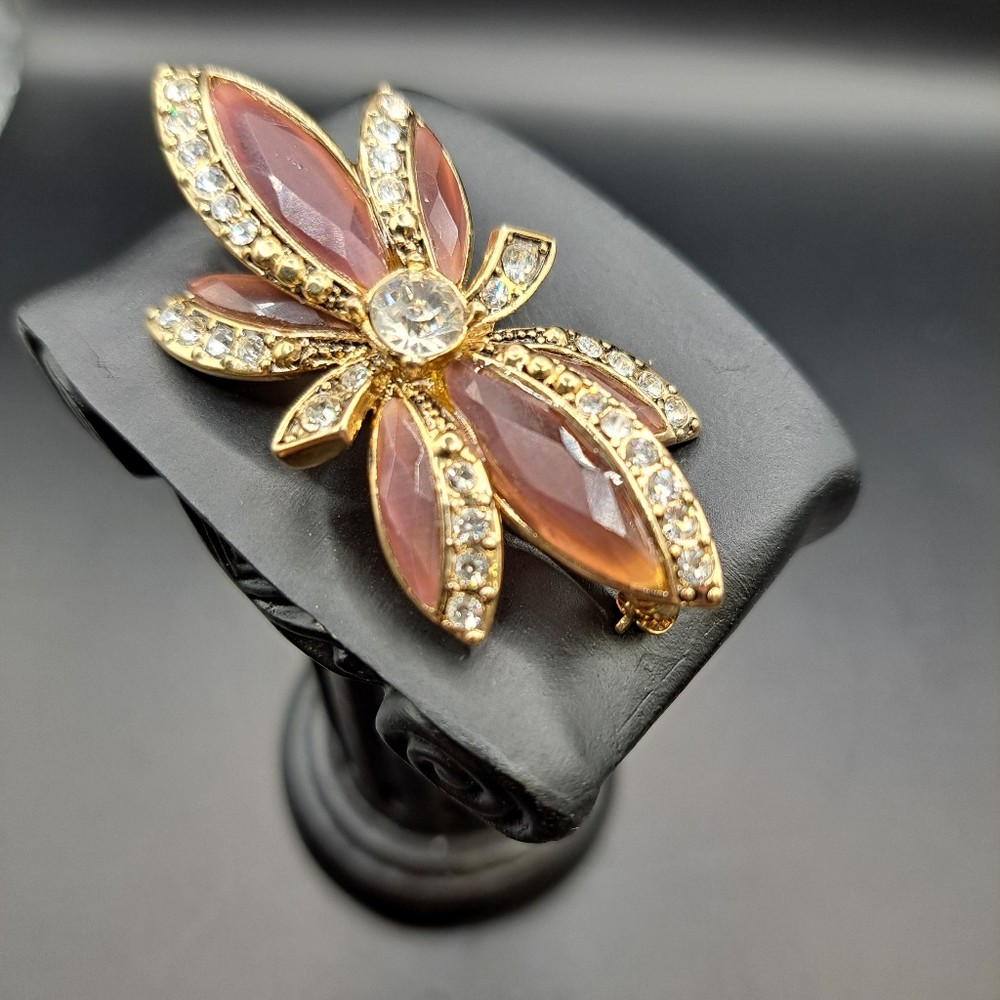 Vintage Monet starburst brooch pink purple stones gold tone metal
